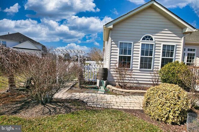 view of side of home with fence