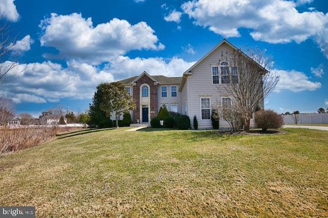 traditional home with a front yard