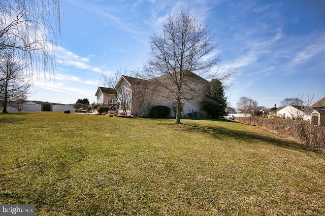 view of home's exterior with a lawn