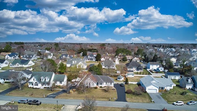 birds eye view of property with a residential view