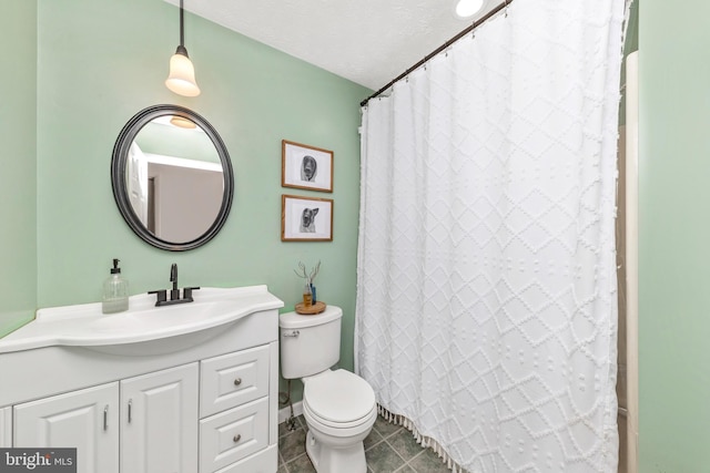 full bath featuring tile patterned flooring, toilet, a shower with shower curtain, vanity, and a textured ceiling