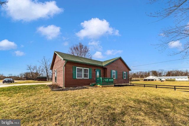 exterior space with a yard and fence