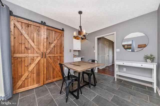 dining room with a barn door