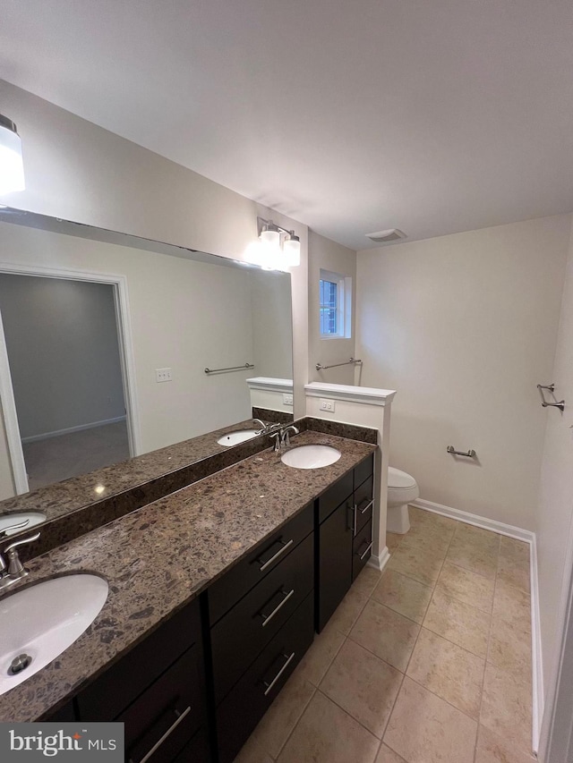 full bathroom featuring a sink, visible vents, toilet, and tile patterned floors