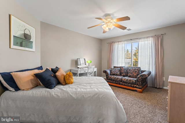 carpeted bedroom with visible vents and a ceiling fan