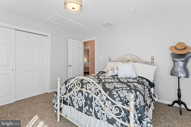 bedroom with attic access, carpet, a closet, and baseboards