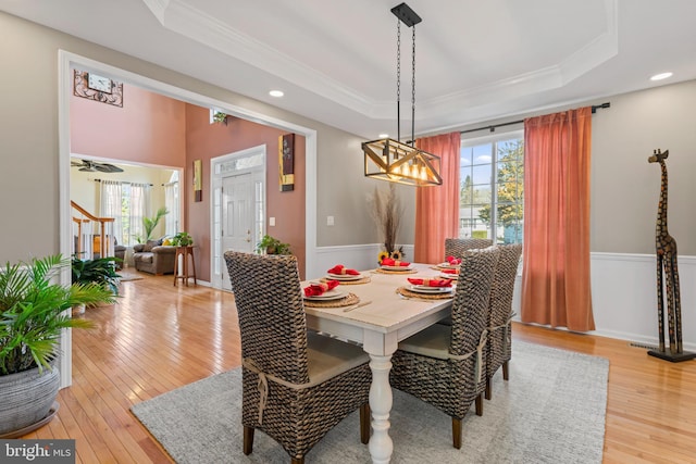 dining room featuring crown molding and a raised ceiling