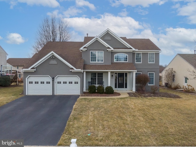 view of front of property featuring stucco siding, aphalt driveway, an attached garage, a shingled roof, and a front yard