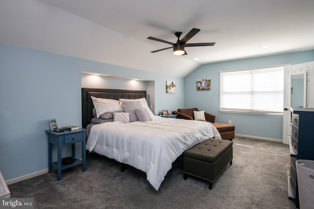 bedroom featuring baseboards, lofted ceiling, carpet floors, and a ceiling fan