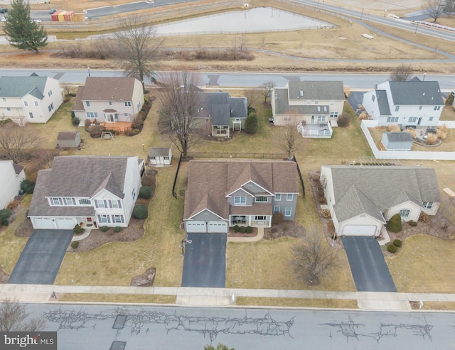 birds eye view of property with a residential view