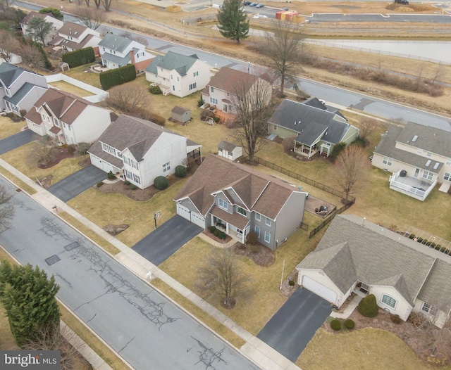 birds eye view of property with a residential view