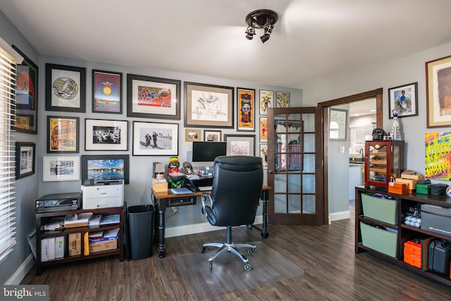 office space featuring wood finished floors and baseboards