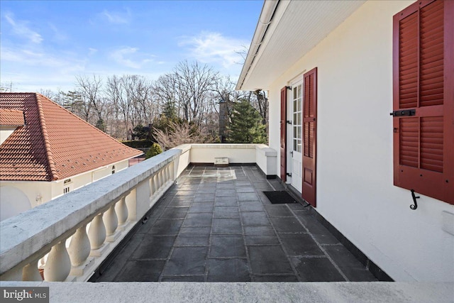 view of patio with a balcony