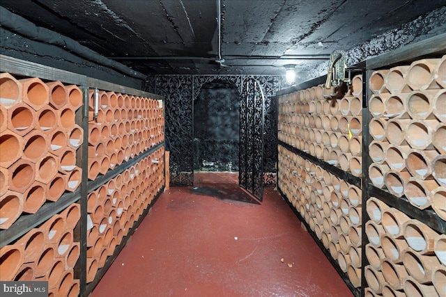 wine cellar featuring concrete flooring