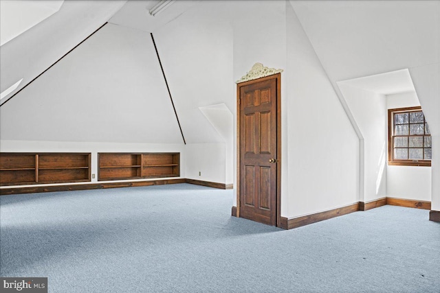 bonus room featuring baseboards, carpet, and vaulted ceiling