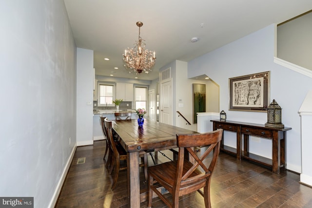 dining space with visible vents, baseboards, recessed lighting, dark wood-style floors, and a notable chandelier