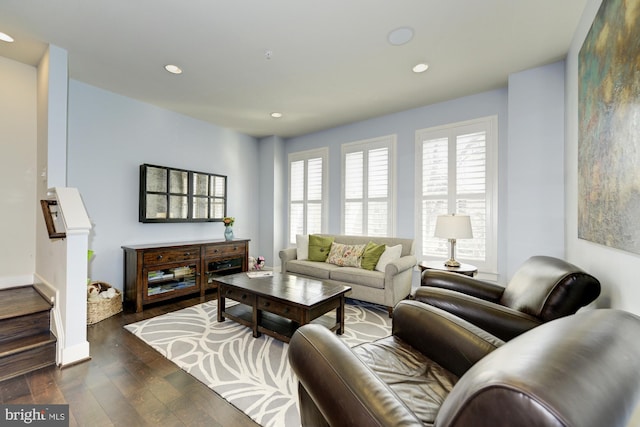 living room with recessed lighting, stairway, baseboards, and dark wood-type flooring