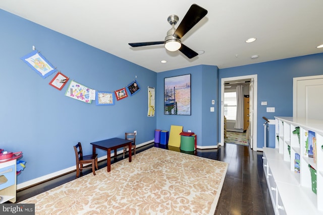 rec room featuring recessed lighting, baseboards, ceiling fan, and dark wood-style flooring