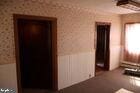 unfurnished bedroom with wallpapered walls