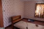 unfurnished bedroom featuring wallpapered walls