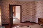 unfurnished bedroom with wallpapered walls