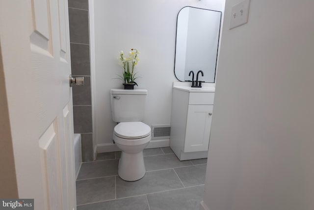 full bathroom featuring tile patterned floors, visible vents, toilet, and vanity