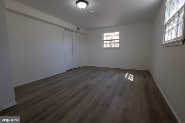 interior space with visible vents and dark wood finished floors