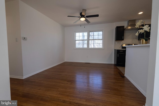 unfurnished living room with recessed lighting, baseboards, dark wood-style floors, and a ceiling fan