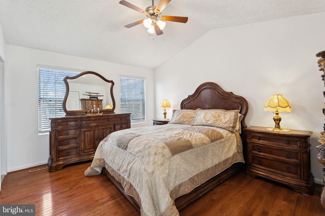 bedroom featuring visible vents, hardwood / wood-style flooring, a textured ceiling, ceiling fan, and vaulted ceiling