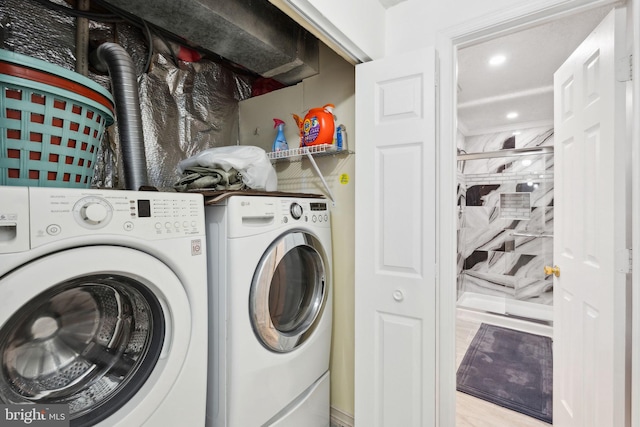 clothes washing area featuring recessed lighting, laundry area, and independent washer and dryer