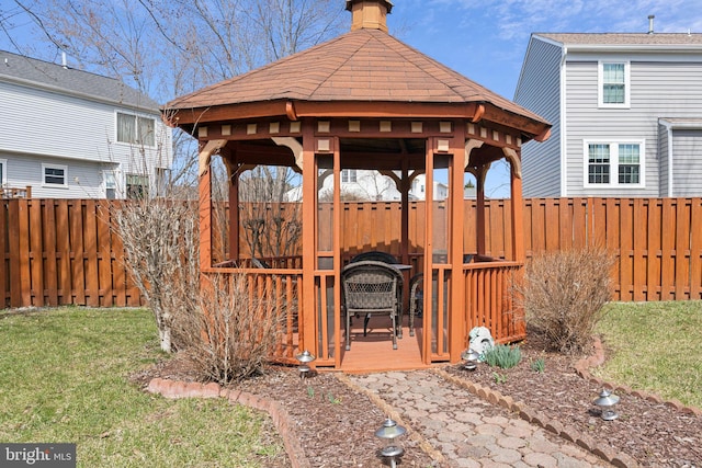 view of yard featuring a gazebo and a fenced backyard