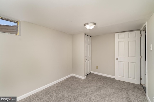 finished basement with baseboards and carpet flooring