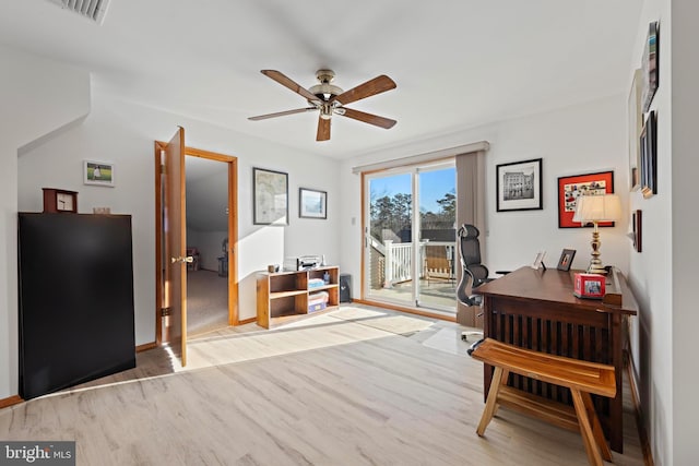 office area with wood finished floors, visible vents, and ceiling fan