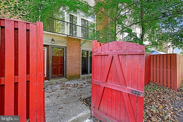 view of gate with fence