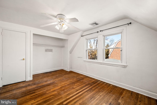 bonus room with visible vents, baseboards, vaulted ceiling, a ceiling fan, and wood-type flooring