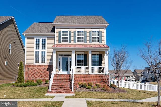 view of front of house with stairway, fence, a porch, a shingled roof, and brick siding