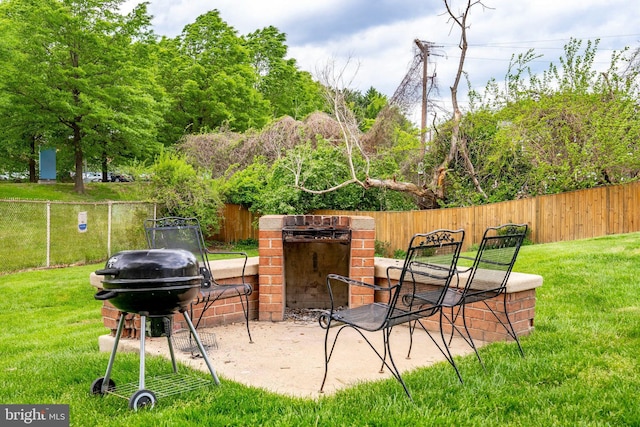 view of patio with a grill and a fenced backyard