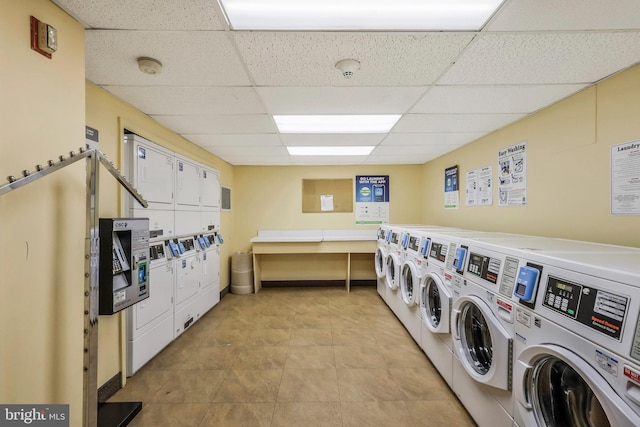 shared laundry area featuring light tile patterned floors, stacked washer / drying machine, and separate washer and dryer