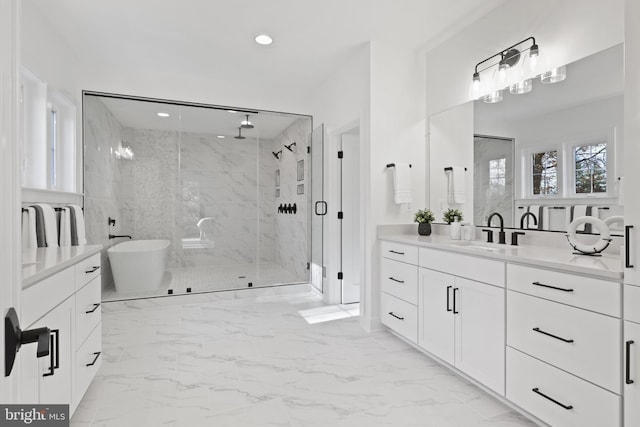 full bath featuring a shower stall, recessed lighting, a soaking tub, marble finish floor, and vanity