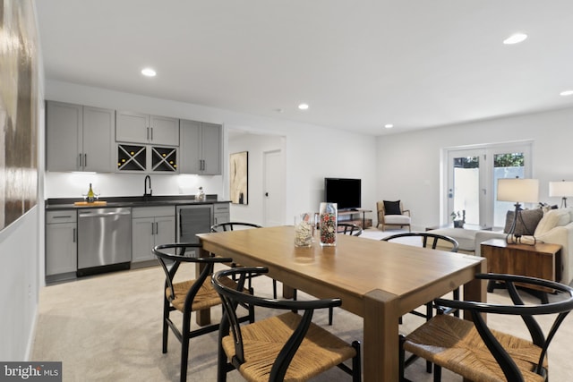 dining space featuring wet bar, wine cooler, recessed lighting, and french doors