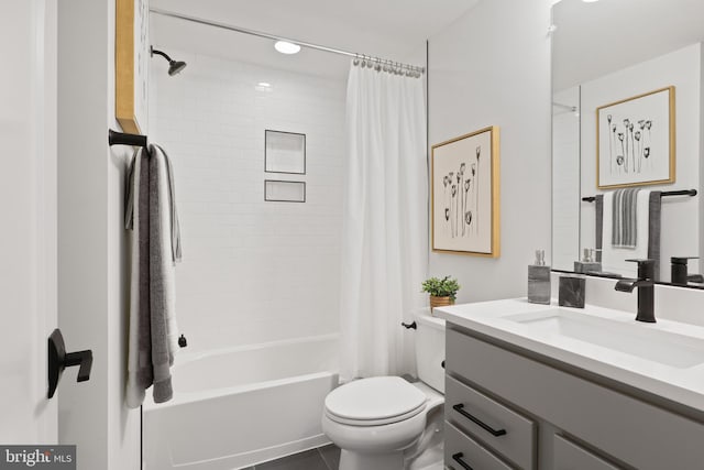 bathroom featuring shower / bathtub combination with curtain, toilet, and vanity