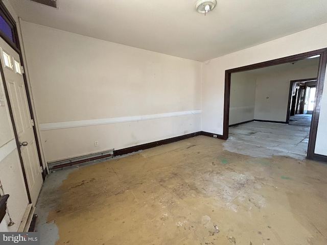 unfurnished room with baseboards and unfinished concrete floors