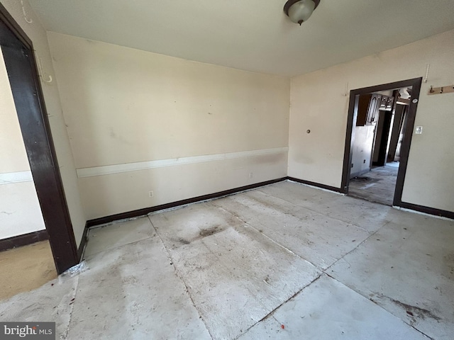 empty room with baseboards