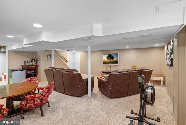 carpeted living area with recessed lighting and visible vents