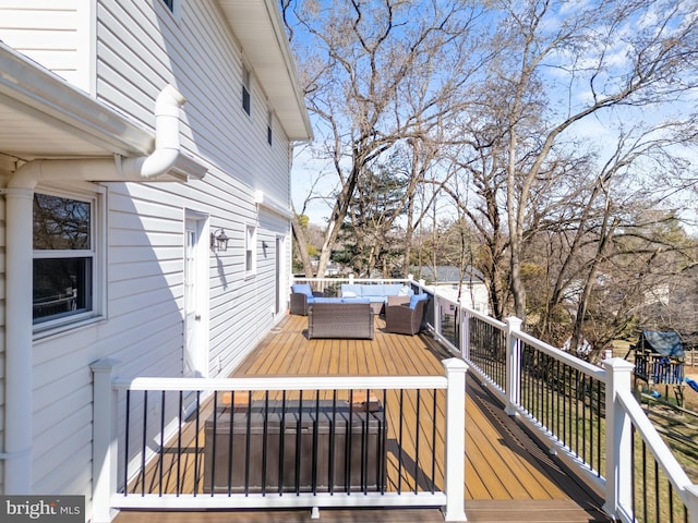 wooden terrace featuring an outdoor hangout area