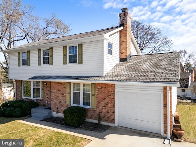 traditional home featuring driveway, a front lawn, an attached garage, brick siding, and a chimney