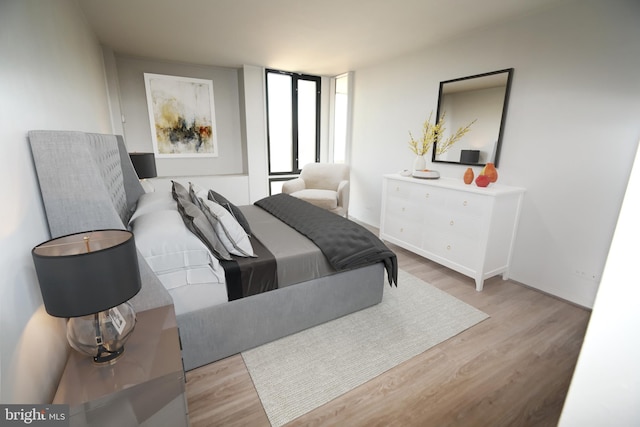 bedroom featuring wood finished floors