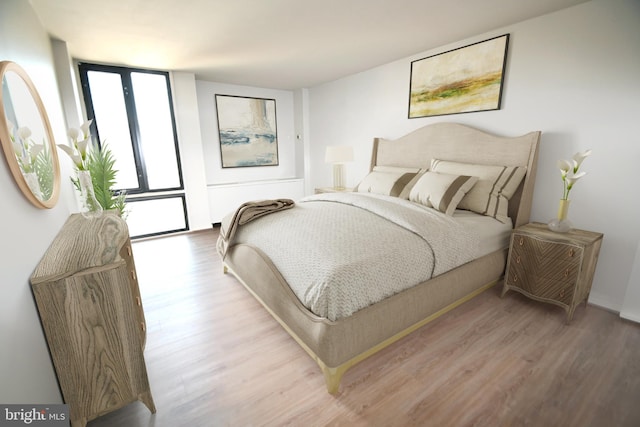 bedroom with wood finished floors