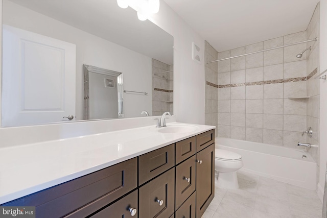 full bath featuring tile patterned floors, shower / bath combination, toilet, and vanity