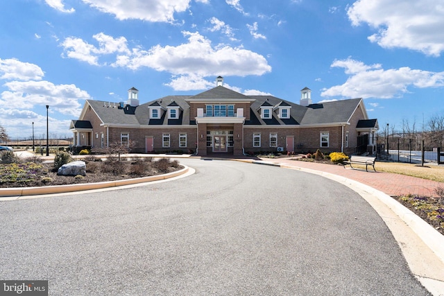 view of front facade featuring brick siding